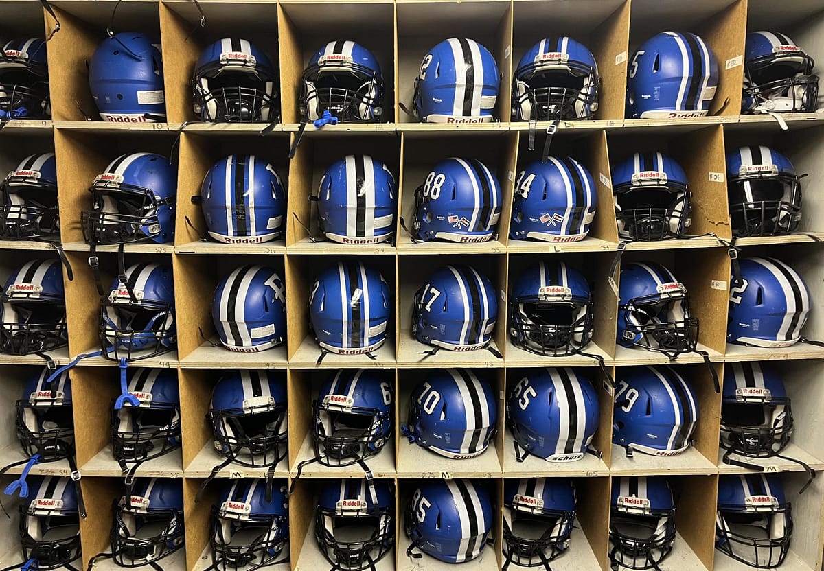 EHS football helmets line the shelves of the storage room at EHS. 11 will soon be replaced with Axion helmets. 